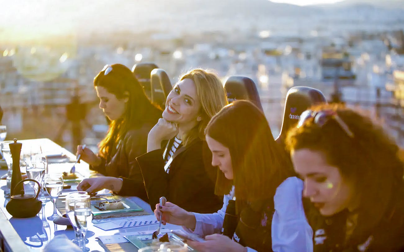 Guests dining at a suspended table during Dinner in the Sky Athens.