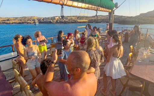 Group enjoying a cruise party on a boat near Ayia Napa's Blue Lagoon.
