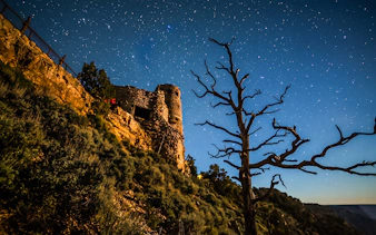 Desert View Watchtower at night under a starry sky, Grand Canyon.