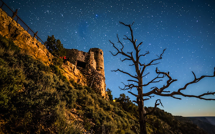 Desert View Watchtower at night under a starry sky, Grand Canyon.