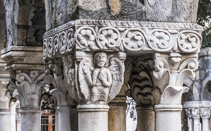 Stone column with intricate carvings at Casa di Colombo, Genoa.