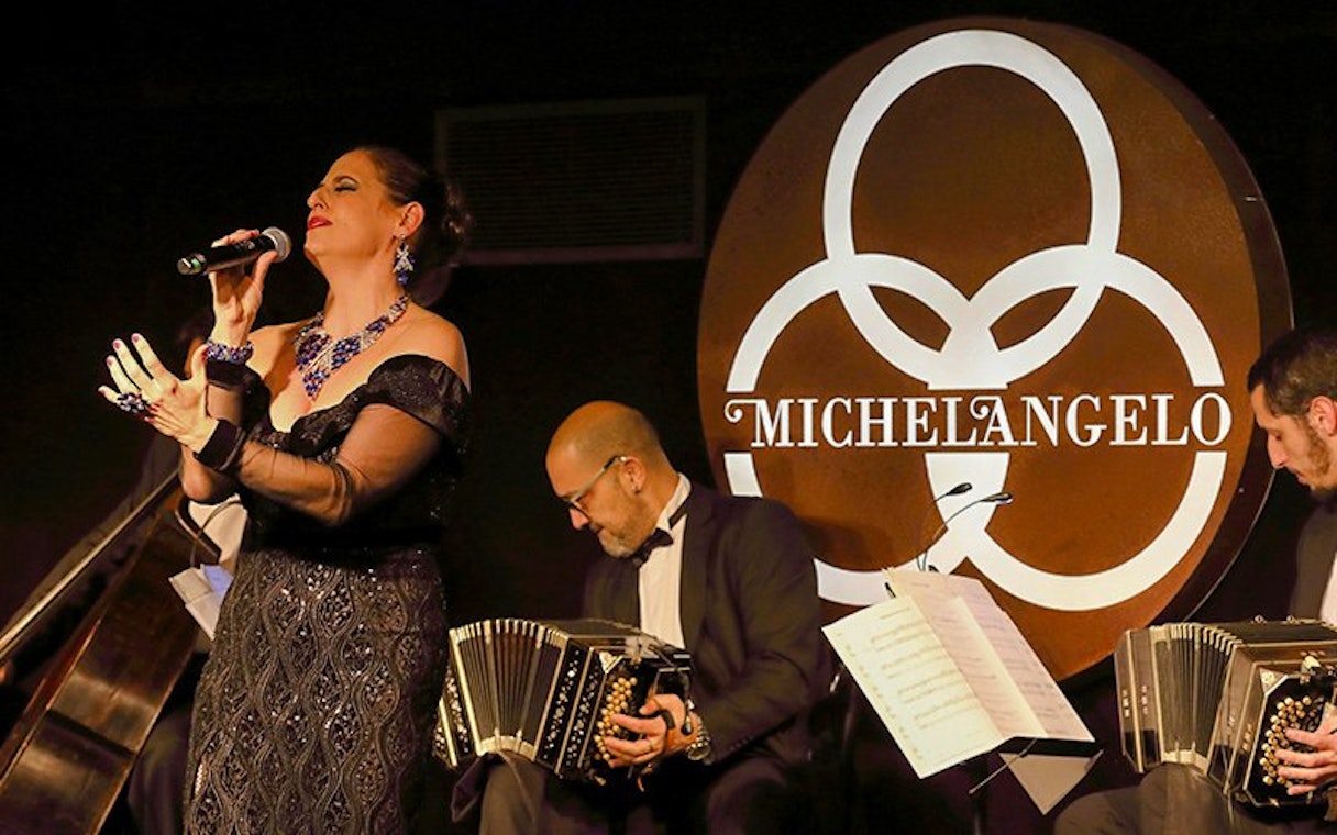 Singer and musicians performing at Michelangelo Tango Show.