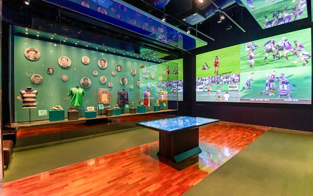Australian Sports Museum exhibit with sports memorabilia and historic photos at Melbourne Cricket Ground.