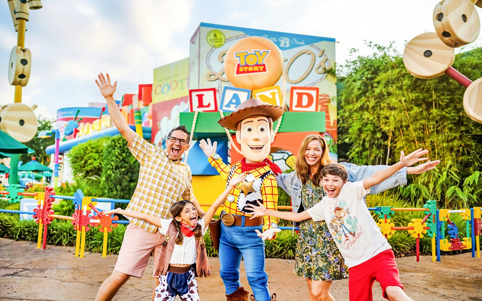 Guests with Woody at Toy Story Land, Animal Kingdom Theme Park, Walt Disney World, Orlando.