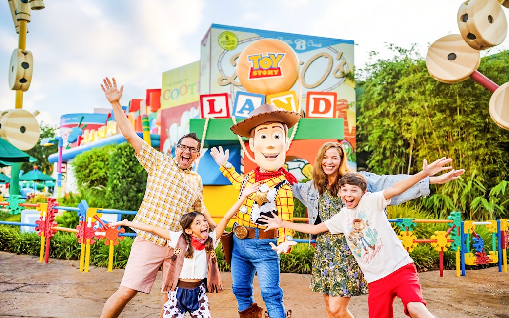 Guests with Woody at Toy Story Land, Animal Kingdom Theme Park, Walt Disney World, Orlando.