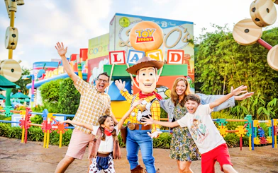Guests with Woody at Toy Story Land, Animal Kingdom Theme Park, Walt Disney World, Orlando.