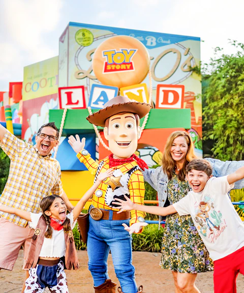 Guests with Woody at Toy Story Land, Animal Kingdom Theme Park, Walt Disney World, Orlando.