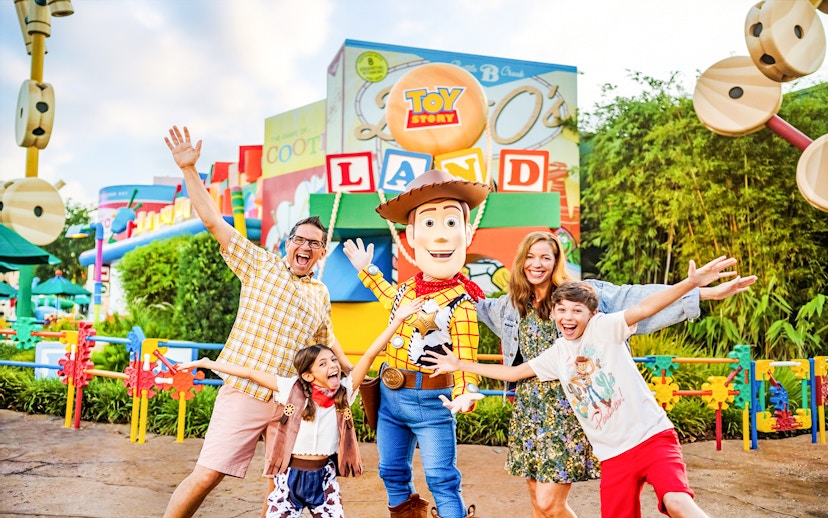 Guests with Woody at Toy Story Land, Animal Kingdom Theme Park, Walt Disney World, Orlando.