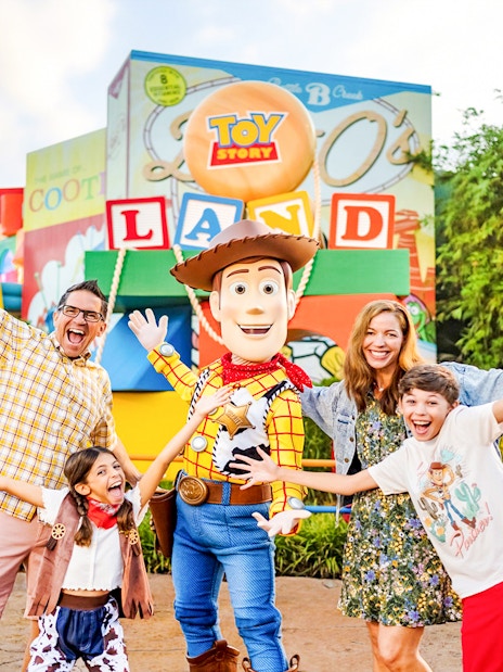 Guests with Woody at Toy Story Land, Animal Kingdom Theme Park, Walt Disney World, Orlando.