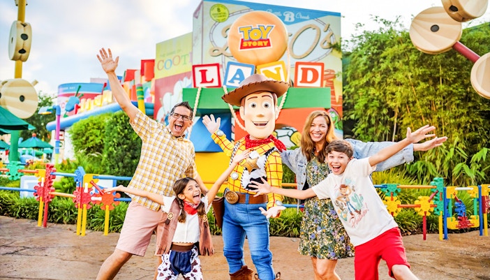 Guests with Woody at Toy Story Land, Animal Kingdom Theme Park, Walt Disney World, Orlando.