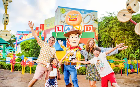 Guests with Woody at Toy Story Land, Animal Kingdom Theme Park, Walt Disney World, Orlando.