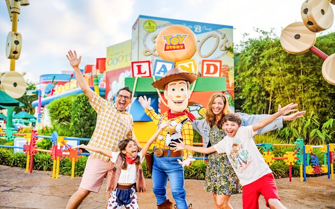 Guests with Woody at Toy Story Land, Animal Kingdom Theme Park, Walt Disney World, Orlando.