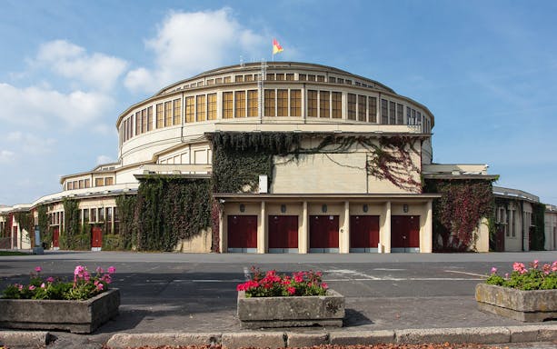Centennial Hall exterior with ivy-covered walls in Wroclaw, Poland.