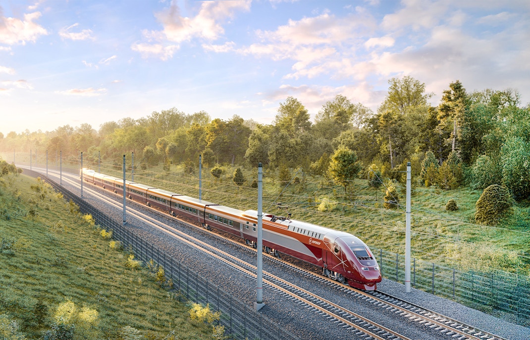 Eurostar train traveling through scenic countryside in Europe.