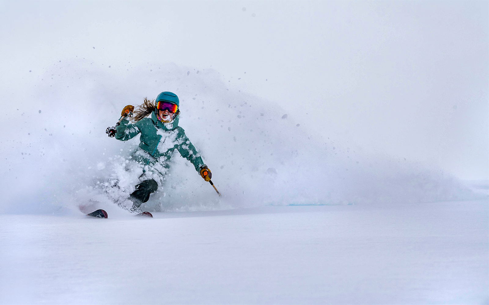 Skier navigating fresh powder snow, showcasing Ikon Pass experience.