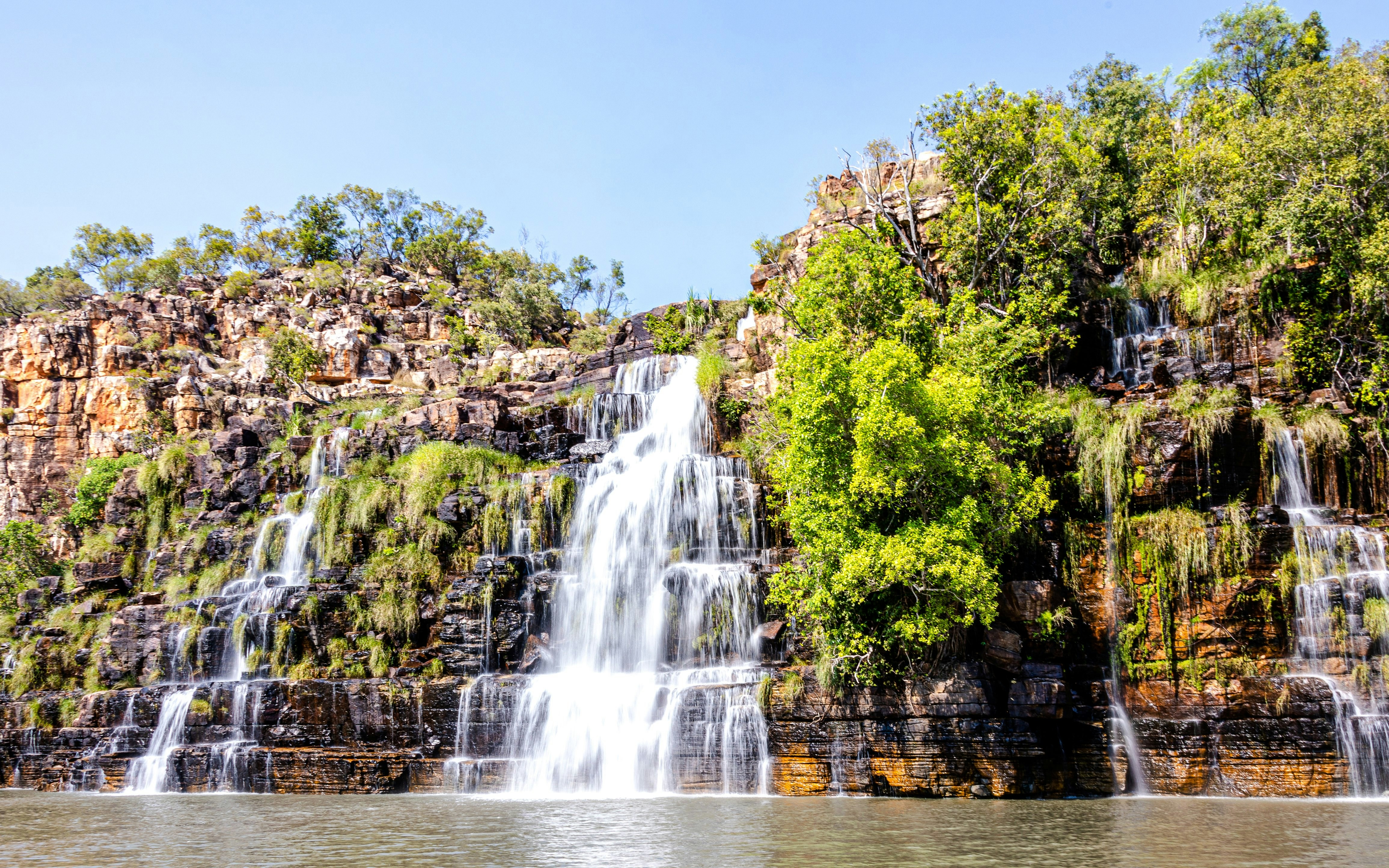 King Cascade Falls cascading over rocky cliffs along Prince Regent River, Kimberley, Australia.