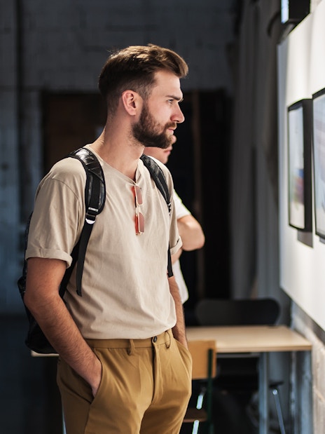 Visitor observing artwork in Galleria Corsini, Rome.