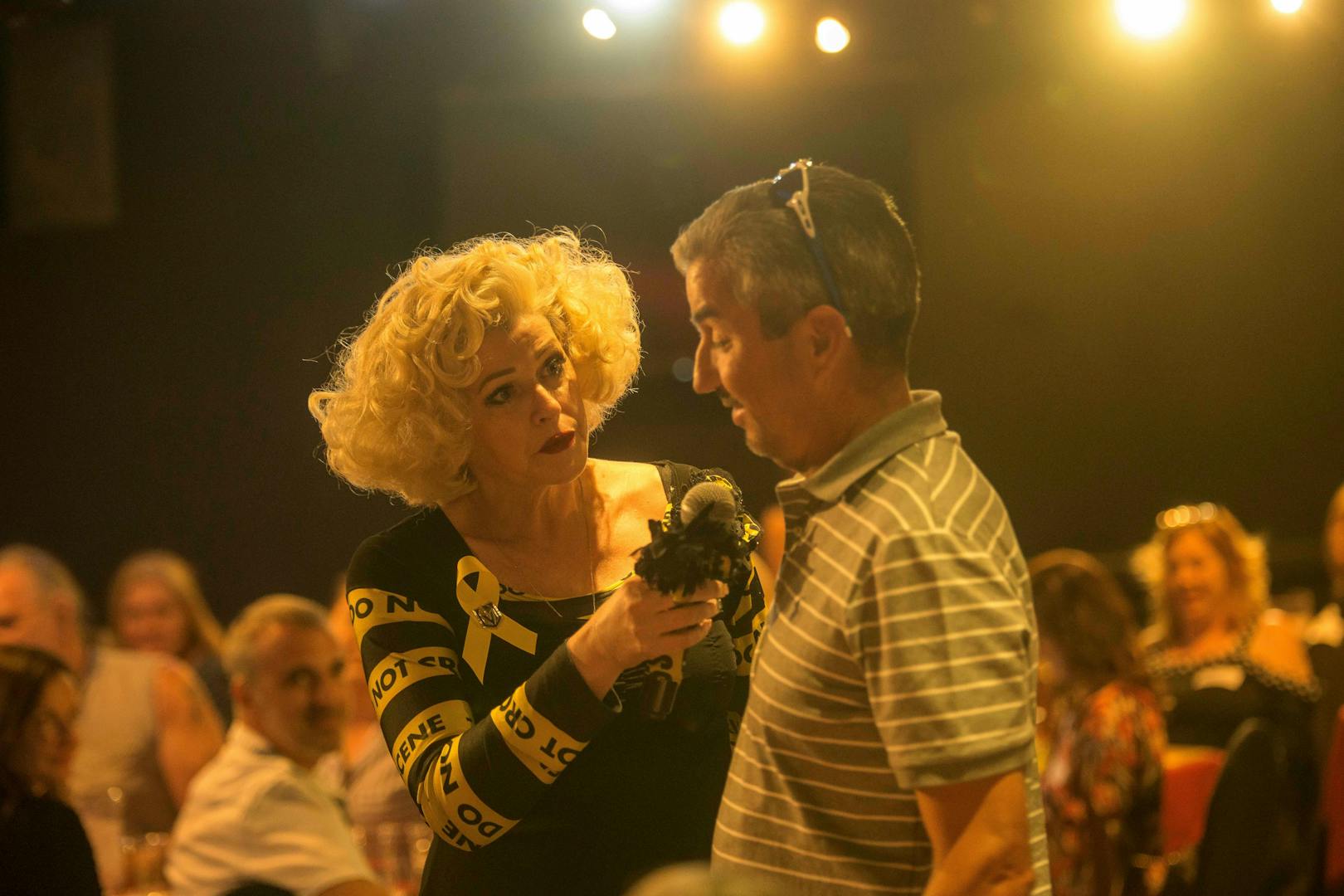 Performer interacting with audience during "Marriage Can Be Murder" show in Las Vegas.