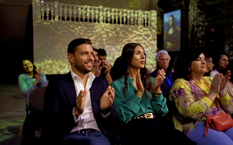 Audience applauding during a Tuscan dinner and Three Tenors concert in Florence.
