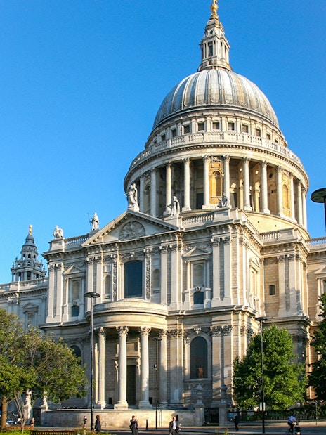 St Paul's Cathedral in London with its iconic dome and surrounding greenery.