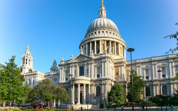 St Paul's Cathedral in London with its iconic dome and surrounding greenery.