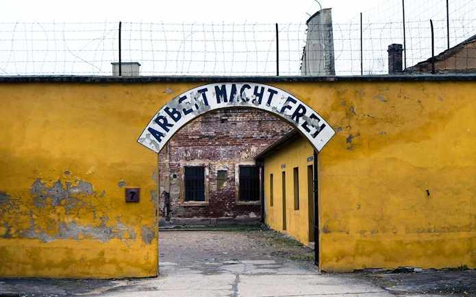 Entrance gate of Terezin concentration camp with "Arbeit Macht Frei" sign.