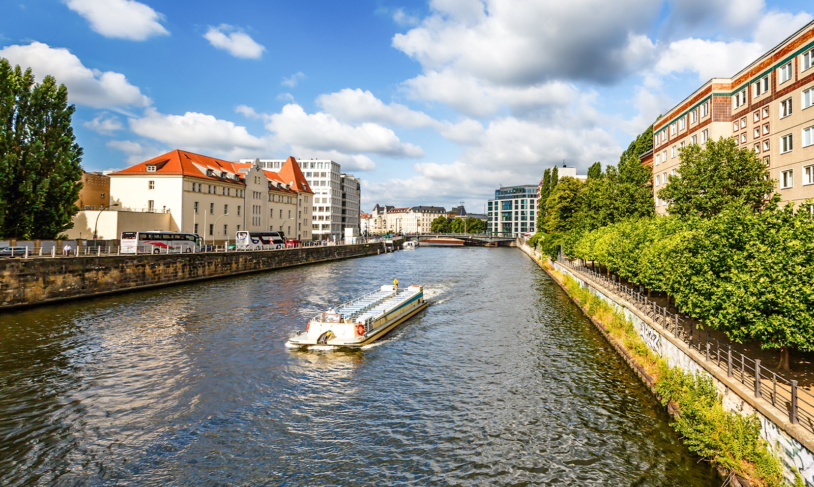 Spree River boat passing Berlin Cathedral and TV Tower on hop-on hop-off tour.