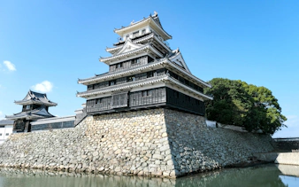 Nakatsu Castle in Kyushu, Japan, with stone walls and traditional architecture.