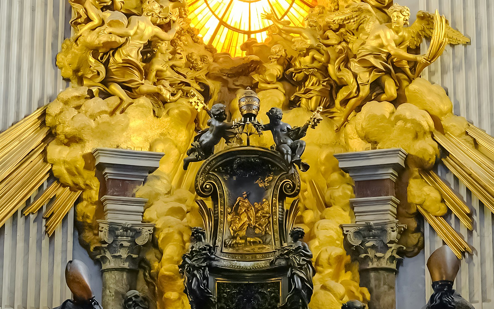 Angels holding Papal symbols near St. Peter's Chair in St. Peter’s Basilica, Vatican City.