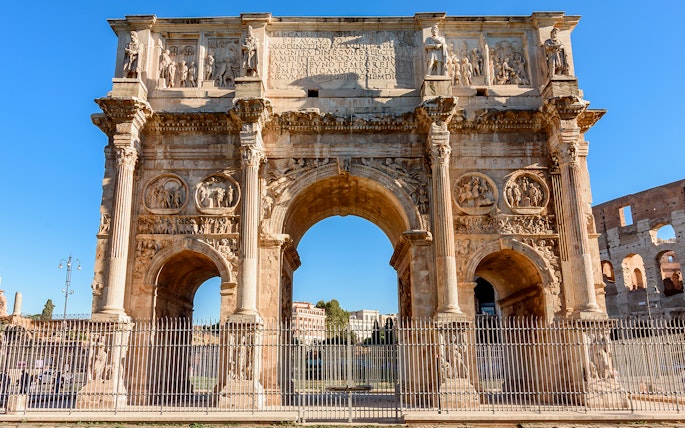 Arch of Constantine near the Colosseum in Rome, part of the guided tour with arena access.