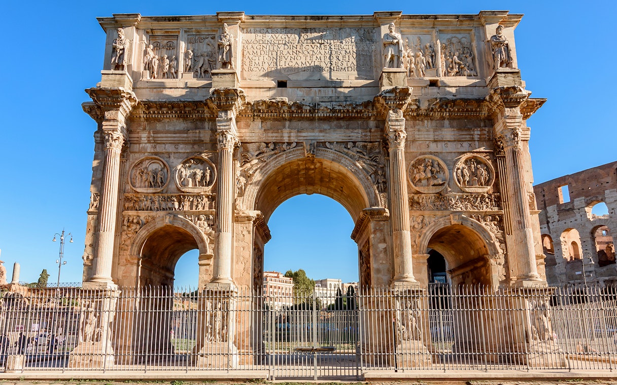Arch of Constantine near the Colosseum in Rome, part of the guided tour with arena access.
