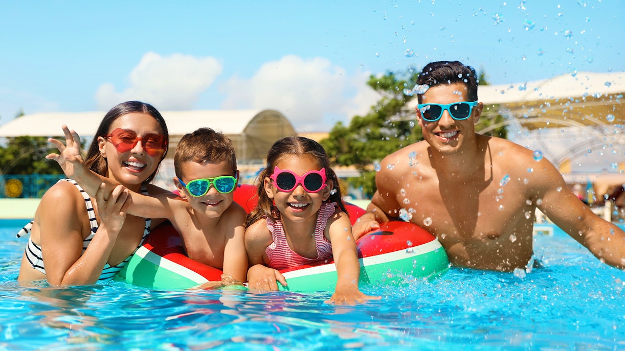 Family enjoying a pool day at Slide N' Splash water park.
