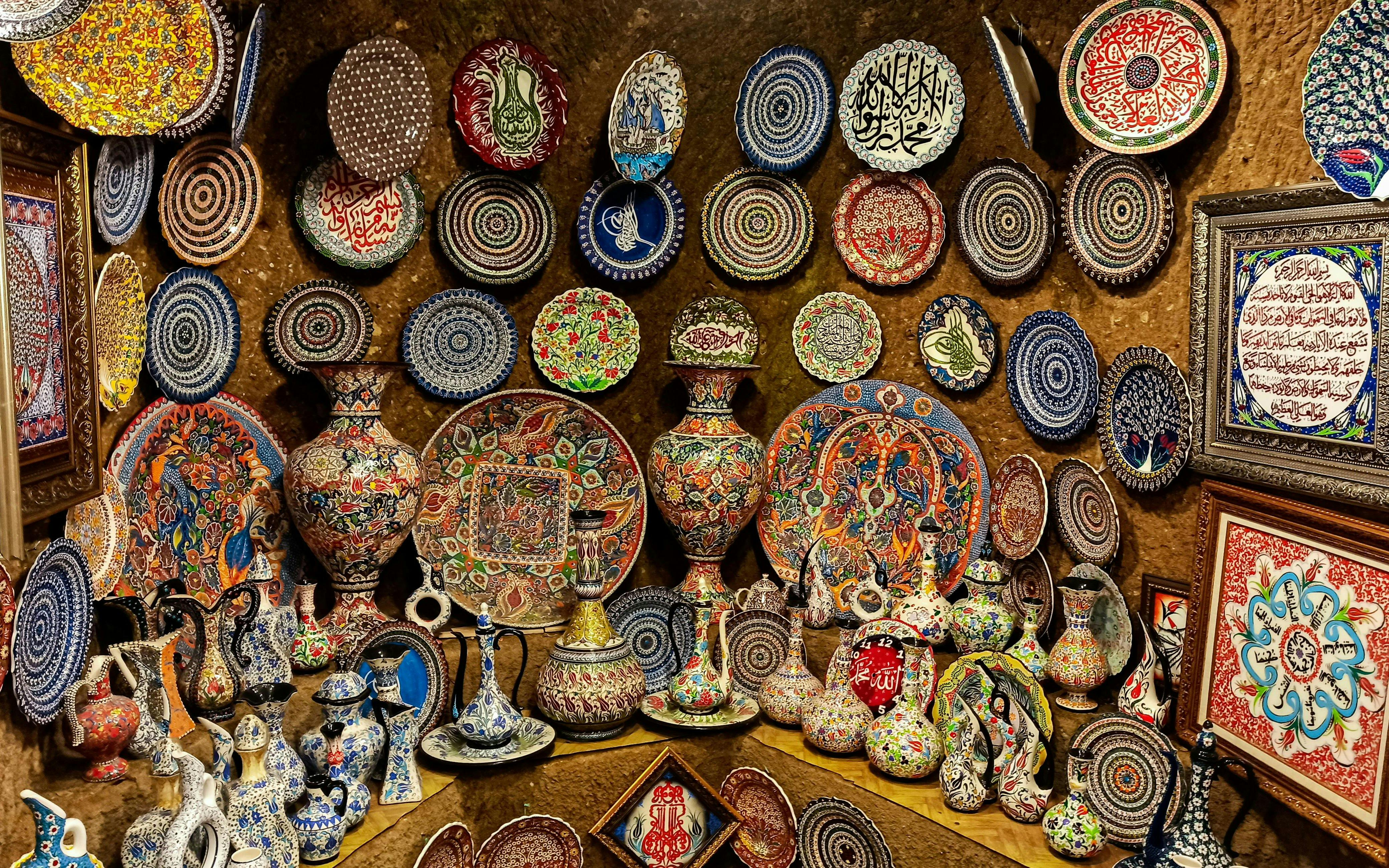 Colorful Hittite wine vessels, ceramic vases, and porcelain bowls displayed in Avanos, Cappadocia.
