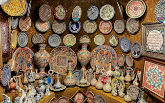 Colorful Hittite wine vessels, ceramic vases, and porcelain bowls displayed in Avanos, Cappadocia.