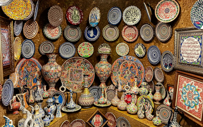 Colorful Hittite wine vessels, ceramic vases, and porcelain bowls displayed in Avanos, Cappadocia.