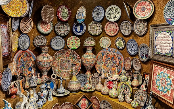 Colorful Hittite wine vessels, ceramic vases, and porcelain bowls displayed in Avanos, Cappadocia.
