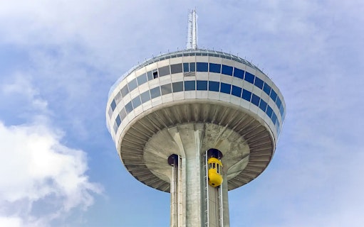 Skylon Tower with yellow elevator against blue sky, Niagara Falls.