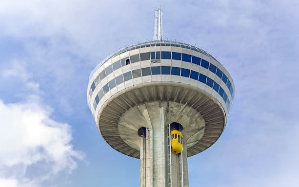 Skylon Tower with yellow elevator against blue sky, Niagara Falls.