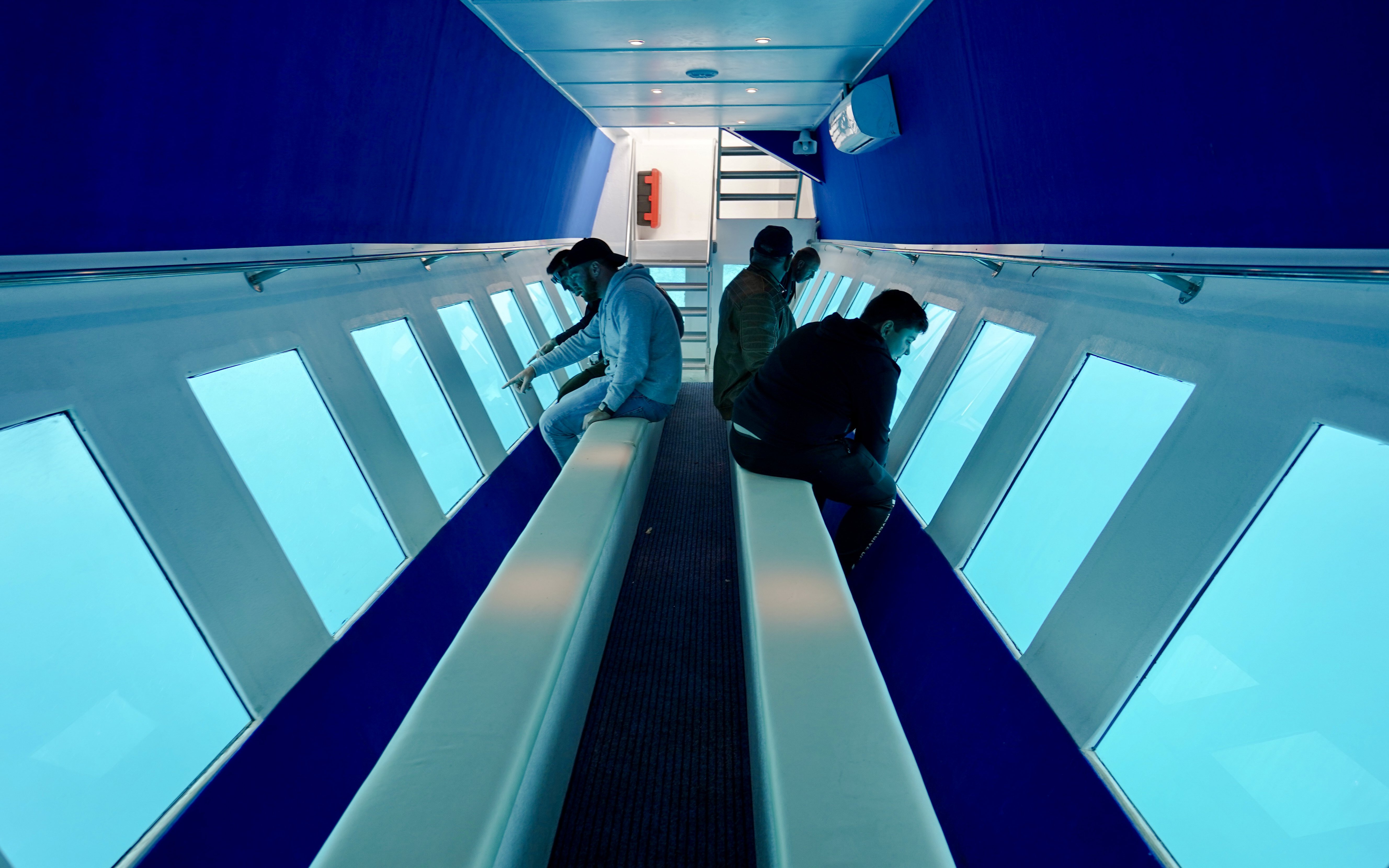 Passengers viewing underwater scenery on Yellow Submarine Cruise, Rhodes.