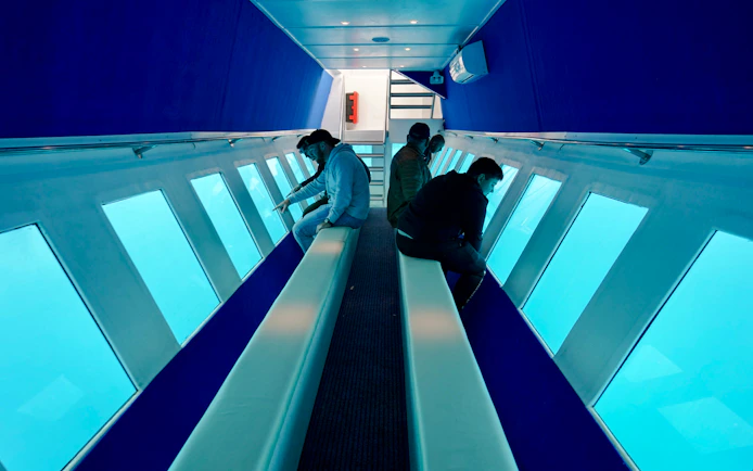 Passengers viewing underwater scenery on Yellow Submarine Cruise, Rhodes.
