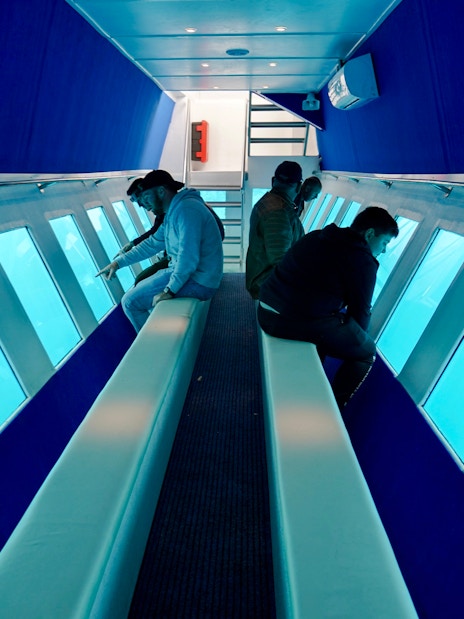Passengers viewing underwater scenery on Yellow Submarine Cruise, Rhodes.