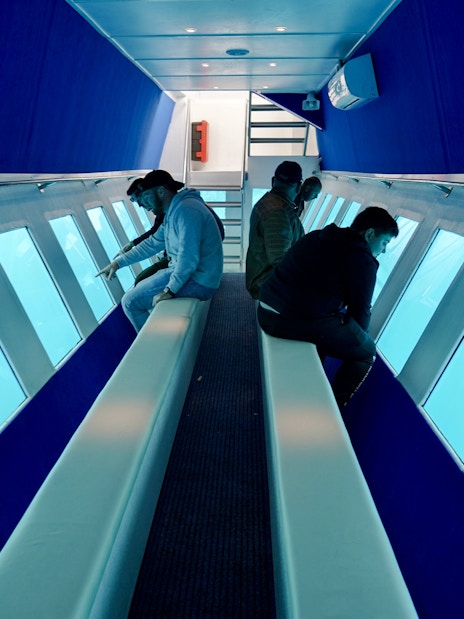 Passengers viewing underwater scenery on Yellow Submarine Cruise, Rhodes.