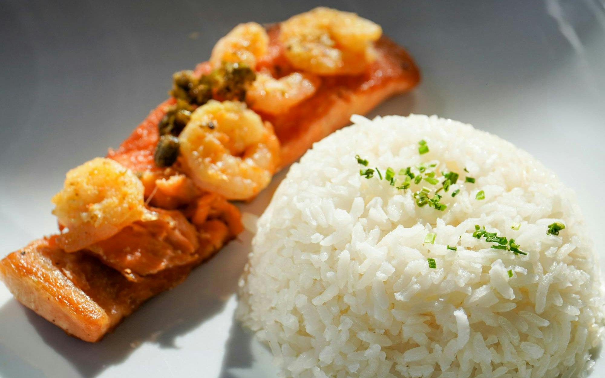 Grilled salmon with shrimp and rice served at Valle Nevado ski resort, Andes Mountains, Chile.