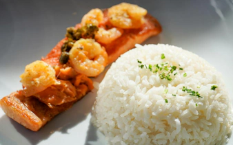 Grilled salmon with shrimp and rice served at Valle Nevado ski resort, Andes Mountains, Chile.