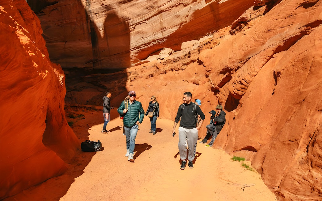 Guests exploring the red rock formations of Antelope Canyon.