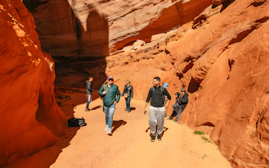 Guests exploring the red rock formations of Antelope Canyon.