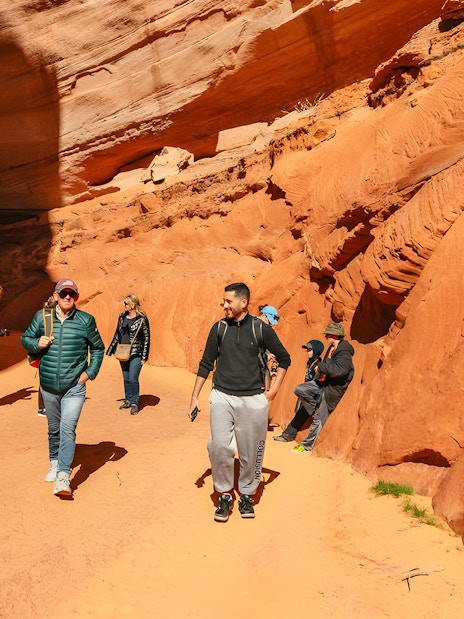 Guests exploring the red rock formations of Antelope Canyon.