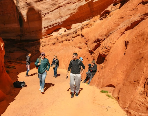Guests exploring the red rock formations of Antelope Canyon.
