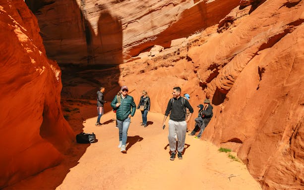 Guests exploring the red rock formations of Antelope Canyon.