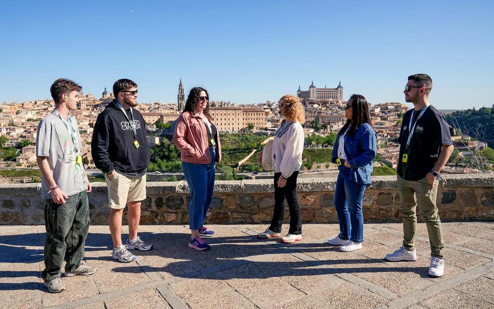 A tour guide giving information to tourist during Toledo Half Day Guided Tour from Madrid